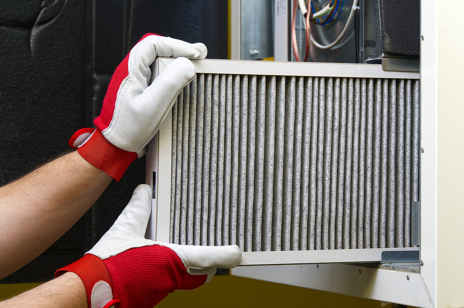 Man Replacing Air Filter In Wichita Ks