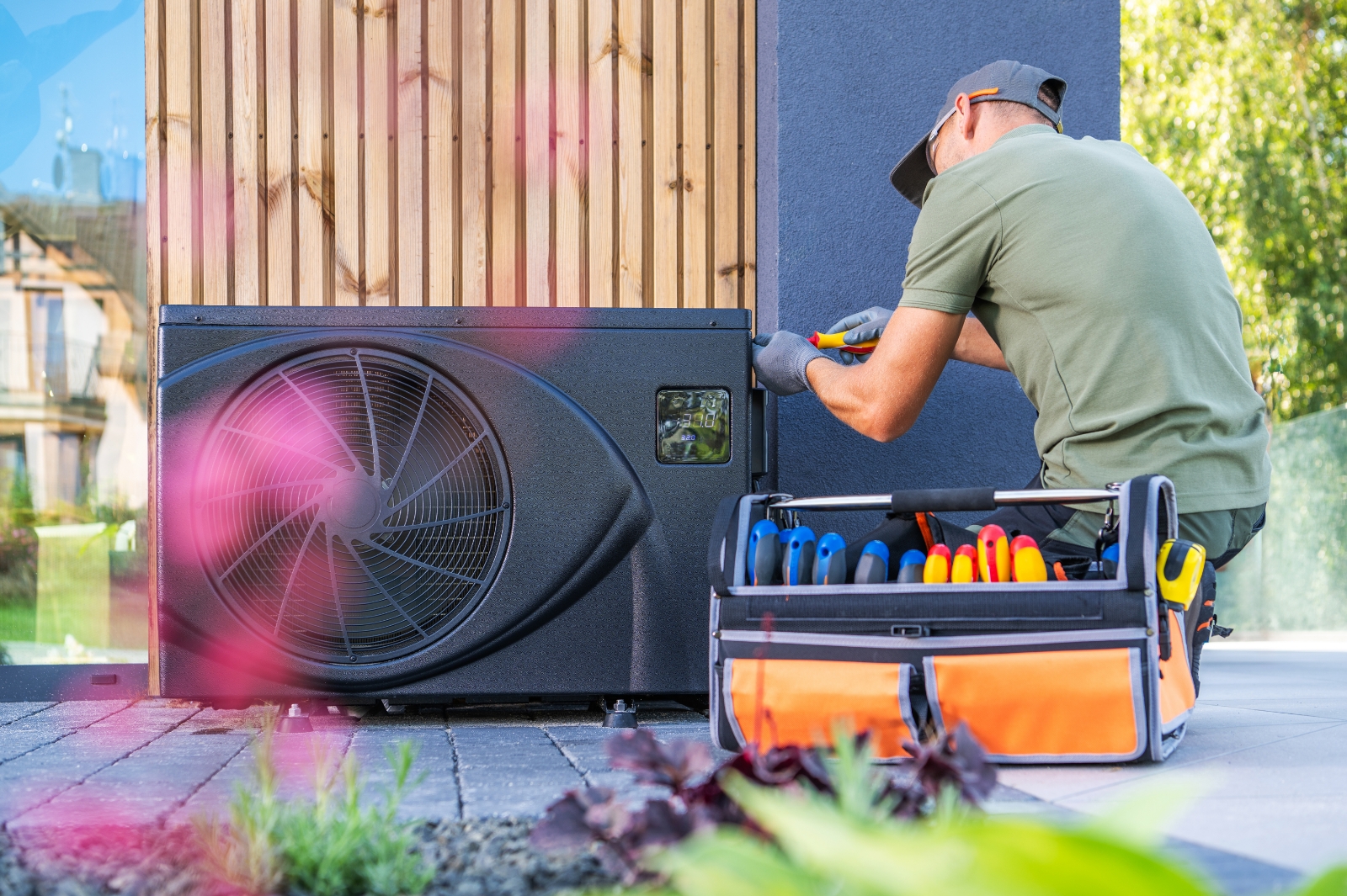 Man Working On Home Air Conditioner In Wichita Ks