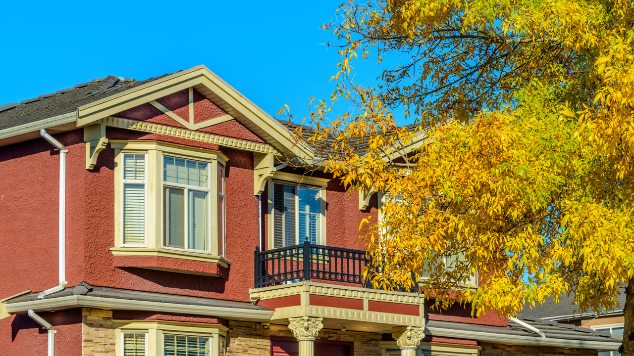 Home And Tree In A Fall Landscape In Wichita Ks