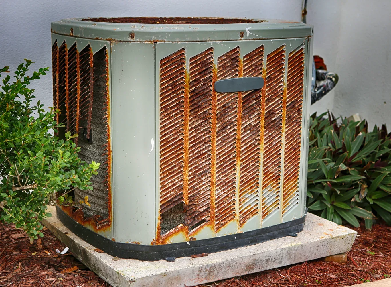 Aging, rusted air conditioner condenser unit needing replacement